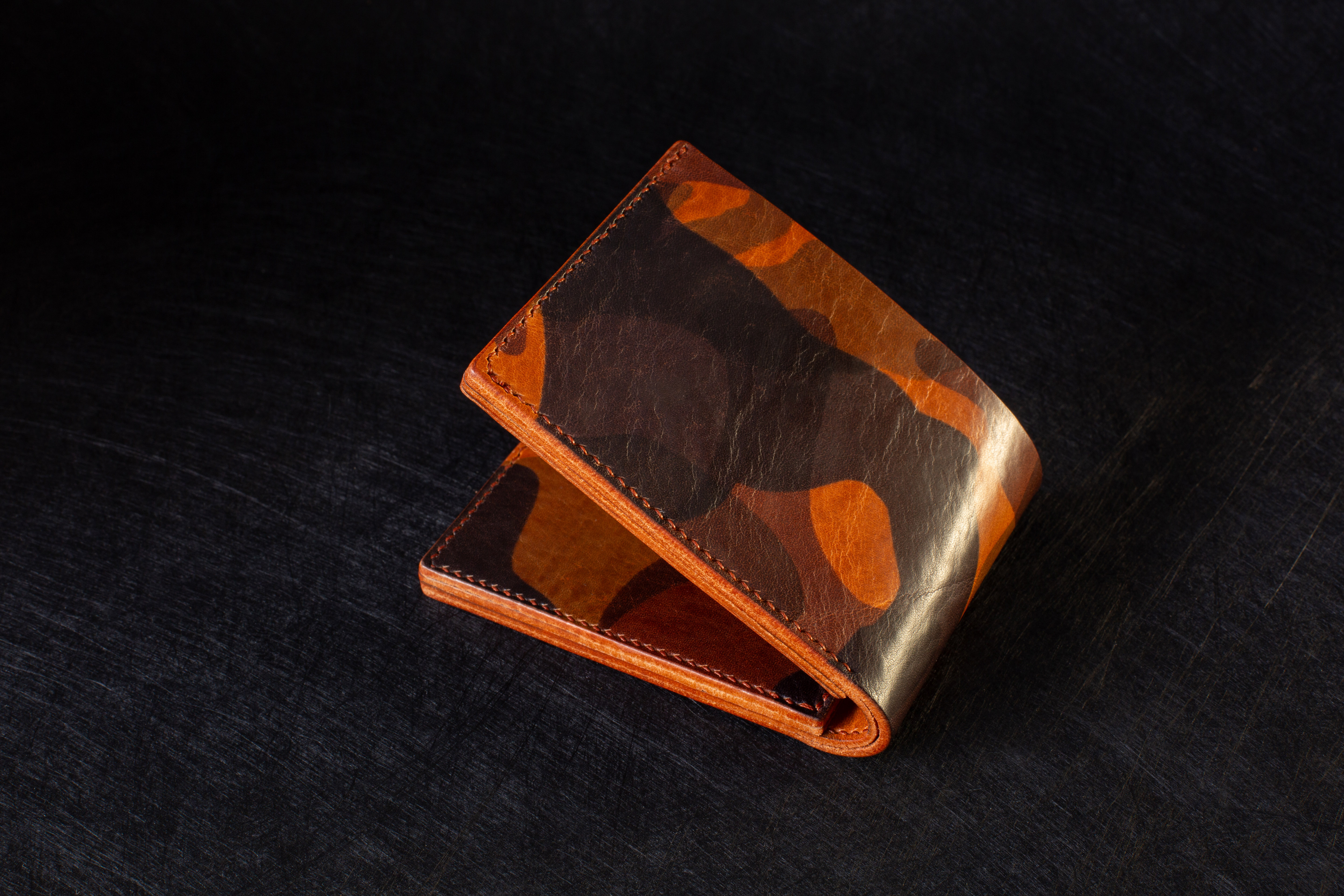 Handmade camo leather wallet. Made from full grain camouflage leather. Handmade, Handsewn, natural veg tan leather backpack, handmade leather backpack, luxury leather backpack, hand leather travel goods,area-1-photography, hand sewn, handmade, handmade-leather-backpack, James-Leask-Frazer, James-Leask-Frazer-Area-1-Photography, leather, luxury-leather-travel-goods, natural-veg-tan-leather-backpack, travel, veg-tan-leather, leather-travel-journal,